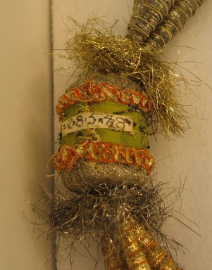  <em>[Illegible] - Necklace Given to Distinguished Guest at Court</em>. Cotton, Silk Tinsel, unid. Stuffing, 3 x 33 in. (7.6 x 83.8 cm). Brooklyn Museum, 28548. Creative Commons-BY (Photo: Brooklyn Museum, CUR.28548_detail1.jpg)