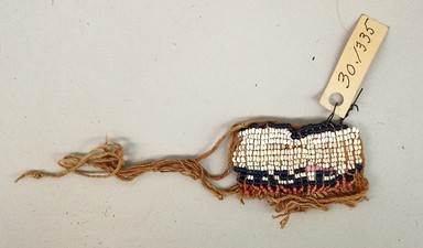 Arekuna. <em>Miniature Apron</em>, early 20th century. Cotton, glass beads, 1 1/2 × 2 1/4 × 3/16 in. (3.8 × 5.7 × 0.5 cm). Brooklyn Museum, Museum Expedition 1930, Robert B. Woodward Memorial Fund and the Museum Collection Fund, 30.1335. Creative Commons-BY (Photo: Brooklyn Museum, CUR.30.1335.jpg)