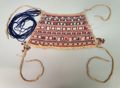 Makushi-Monaiko. <em>Woman's Apron</em>, early 20th century. Glass beads, cotton, seeds, 7 × 13 1/4 × 11/16 in. (17.8 × 33.7 × 1.7 cm). Brooklyn Museum, Museum Expedition 1930, Robert B. Woodward Memorial Fund and the Museum Collection Fund, 30.1352. Creative Commons-BY (Photo: Brooklyn Museum, CUR.30.1352.jpg)