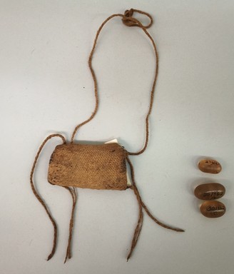 Arekuna. <em>Bag Containing Three Crystals</em>, early 20th century. Cotton, quartz crystal, Bag (d): 11 3/8 × 3 × 1/2 in. (28.9 × 7.6 × 1.3 cm). Brooklyn Museum, Museum Expedition 1930, Robert B. Woodward Memorial Fund and the Museum Collection Fund, 30.1362a-d. Creative Commons-BY (Photo: Brooklyn Museum, CUR.30.1362.jpg)
