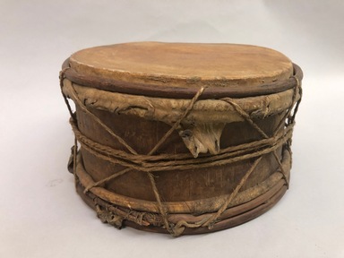 Atorai, Atorac. <em>Drum</em>, early 20th century. Wood, animal hide, fiber, 5 3/4 × 11 × 11 in. (14.6 × 27.9 × 27.9 cm). Brooklyn Museum, Museum Expedition 1930, Robert B. Woodward Memorial Fund and the Museum Collection Fund, 30.1392. Creative Commons-BY (Photo: Brooklyn Museum, CUR.30.1392_view01.jpeg)
