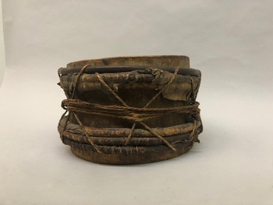 Atorai, Atorac. <em>Drum</em>, early 20th century. Wood, animal hide, fiber, 6 3/4 × 11 × 11 in. (17.1 × 27.9 × 27.9 cm). Brooklyn Museum, Museum Expedition 1930, Robert B. Woodward Memorial Fund and the Museum Collection Fund, 30.1393. Creative Commons-BY (Photo: Brooklyn Museum, CUR.30.1393_view01.jpeg)