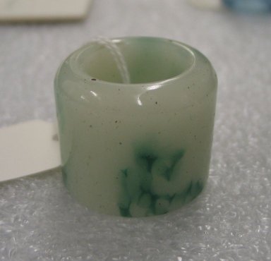  <em>Thumb Ring</em>, 20th century. Glass, 1 3/16 x 1 7/16 in. (3 x 3.7 cm). Brooklyn Museum, Estate of Stewart Culin, Museum Purchase, 30.216. Creative Commons-BY (Photo: Brooklyn Museum, CUR.30.216_side1.jpg)