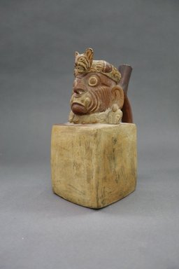 Moche. <em>Square Vessel with Wrinkle Face</em>, 400-500. Ceramic, cream and red (ocher) slip, 7 15/16 x 4 x 6 in. (20.2 x 10.2 x 15.2 cm). Brooklyn Museum, 30.886. Creative Commons-BY (Photo: , CUR.30.886_threequarter.jpg)