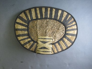 Mangbetu. <em>Woman’s Bustle (Negbe) and Front Piece (Nogimwu)</em>, early 20th century. Banana leaf, raffia, a: 9 5/8 x 13 3/16 in. (24.4 x 33.5 cm). Brooklyn Museum, Museum Expedition 1931, Robert B. Woodward Memorial Fund, 31.1835a-b. Creative Commons-BY (Photo: Brooklyn Museum, CUR.31.1835a_front.jpg)