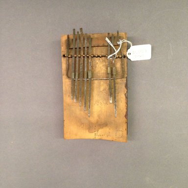 Mangbetu ?. <em>Plucked Idiophone (Sanza)</em>, early 20th century. Wood, metal, 1 5/8 x 6 1/2 x 3 5/8 in. (4.8 x 16.5 x 9.8 cm). Brooklyn Museum, Museum Expedition 1931, Robert B. Woodward Memorial Fund, 31.1857. Creative Commons-BY (Photo: Brooklyn Museum, CUR.31.1857.jpg)