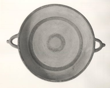 Cypriot. <em>Plate</em>, 950-700 B.C.E. Terracotta, slip, 1 9/16 x diam. w/handles 10 1/16 in. (4 x 25.6 cm). Brooklyn Museum, Charles Edwin Wilbour Fund, 32.1716.3. Creative Commons-BY (Photo: Brooklyn Museum, CUR.32.1716.3_NegA_print_bw.jpg)