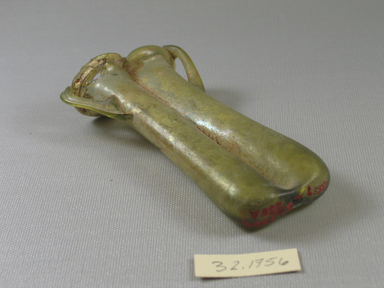 Roman. <em>Double Cosmetic Tube with Handles</em>, 4th-6th century C.E. Glass, 5 1/4 x 1 3/16 x 2 7/16 in. (13.3 x 3 x 6.2 cm). Brooklyn Museum, Gift of the executors of the Estate of Colonel Michael Friedsam, 32.1756. Creative Commons-BY (Photo: Brooklyn Museum, CUR.32.1756_view1.jpg)