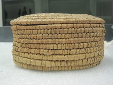  <em>Oval Shaped Basket With Lid</em>, early 20th century. Fiber, height: 3 in. (7.5 cm). Brooklyn Museum, Gift of Theodora Wilbour, 32.1771a-b. Creative Commons-BY (Photo: Brooklyn Museum, CUR.32.1771a-b_side.jpg)