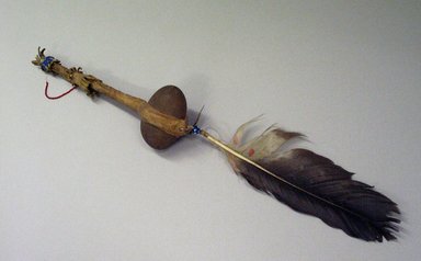 Blackfoot. <em>War Club</em>, 19th century. Stone, wood, hide, feather, beads, 12 1/2 with stone 2 1/2 x 3 1/2 and feather 10 in. (31.8 x 6.4 x 8.9 x 25.4 cm). Brooklyn Museum, Bequest of W.S. Morton Mead, 32.2099.32570. Creative Commons-BY (Photo: Brooklyn Museum, CUR.32.2099.32570.jpg)