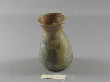 Roman. <em>Vase</em>, 3rd-4th century C.E. Glass, 3 7/16 x Diam. 2 5/16 in. (8.7 x 5.8 cm)  . Brooklyn Museum, Gift of the executors of the Estate of Colonel Michael Friedsam, 32.736. Creative Commons-BY (Photo: Brooklyn Museum, CUR.32.736_view1.jpg)