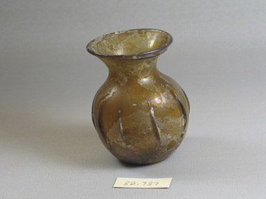 Roman. <em>Bottle</em>, 2nd–3rd century C.E. Glass, 3 1/4 x Diam. 2 9/16 in. (8.3 x 6.5 cm). Brooklyn Museum, Gift of the executors of the Estate of Colonel Michael Friedsam, 32.737. Creative Commons-BY (Photo: Brooklyn Museum, CUR.32.737.jpg)