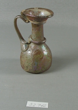 Roman. <em>Miniature Jug</em>, 1st-4th century C.E. Glass, 3 1/4 x Diam. 1 3/4 in. (8.3 x 4.4 cm). Brooklyn Museum, Gift of the executors of the Estate of Colonel Michael Friedsam, 32.742. Creative Commons-BY (Photo: Brooklyn Museum, CUR.32.742_view1.jpg)