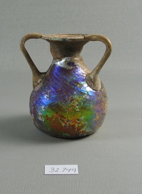 Roman. <em>Three Handled Vase</em>, 1st-4th century C.E. Glass, 3 3/16 x Diam. 2 13/16 in. (8.1 x 7.1 cm). Brooklyn Museum, Gift of the executors of the Estate of Colonel Michael Friedsam, 32.744. Creative Commons-BY (Photo: Brooklyn Museum, CUR.32.744_view1.jpg)