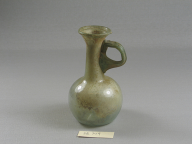 Roman. <em>Jug</em>, 1st-4th century C.E. Glass, 4 1/8 x Diam. 2 5/16 in. (10.4 x 5.9 cm) . Brooklyn Museum, Gift of the executors of the Estate of Colonel Michael Friedsam, 32.749. Creative Commons-BY (Photo: Brooklyn Museum, CUR.32.749.jpg)