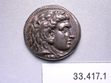 Greek or Roman. <em>Tetradrachm</em>, 336-323 B.C.E. Silver, 3/16 x 1 in. (0.4 x 2.5 cm). Brooklyn Museum, Charles Edwin Wilbour Fund, 33.417.1. Creative Commons-BY (Photo: Brooklyn Museum, CUR.33.417.1_heads.jpg)
