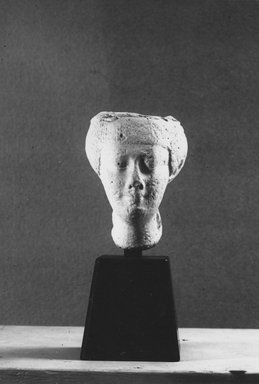  <em>Model of a Woman's Head</em>, 332-30 B.C.E. Plaster, 3 3/8 × 2 1/2 in. (8.6 × 6.4 cm). Brooklyn Museum, Charles Edwin Wilbour Fund, 33.592. Creative Commons-BY (Photo: Brooklyn Museum, CUR.33.592_NegB_print.bw.jpg)