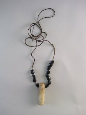 Tukano. <em>Necklace with Quartz Pendant</em>, early 20th century. Plant fiber, seeds, and quartz, 2 1/2 × 3/4 × 13 1/4 in. (6.4 × 1.9 × 33.7 cm). Brooklyn Museum, Museum Expedition 1933, Purchased with funds given by Jesse Metcalf, 33.640. Creative Commons-BY (Photo: Brooklyn Museum, CUR.33.640.jpg)