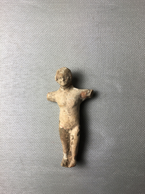  <em>Doll</em>. Clay, pigment, 3 1/16 × 1 1/2 × 11/16 in. (7.8 × 3.8 × 1.7 cm). Brooklyn Museum, Charles Edwin Wilbour Fund, 34.1007. Creative Commons-BY (Photo: , CUR.34.1007_view01.jpg)