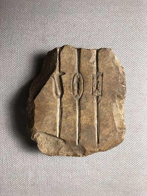  <em>Jeweler's Mold for Making Amulets</em>, 30 B.C.E. –395 C.E. Limestone, 2 15/16 × 2 5/8 × 3/4 in. (7.5 × 6.7 × 1.9 cm). Brooklyn Museum, Charles Edwin Wilbour Fund, 34.1188. Creative Commons-BY (Photo: , CUR.34.1188_view01.jpg)