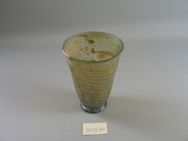 Roman. <em>Goblet</em>, 1st-5th century C.E. Glass, 4 1/4 x greatest diam. 3 1/16 in. (10.8 x 7.8 cm). Brooklyn Museum, Brooklyn Museum Collection, 34.5577. Creative Commons-BY (Photo: Brooklyn Museum, CUR.34.5577.jpg)