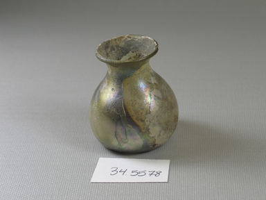 Roman. <em>Bottle</em>, 3rd-4th century C.E. Glass, 2 1/16 x greatest diam. 1 13/16 in. (5.2 x 4.6 cm). Brooklyn Museum, Brooklyn Museum Collection, 34.5578. Creative Commons-BY (Photo: Brooklyn Museum, CUR.34.5578_view1.jpg)
