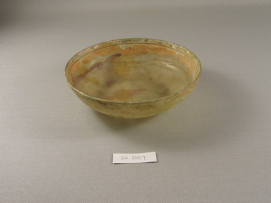 Roman. <em>Shallow Bowl</em>, 1st-5th century C.E. Glass, 1 3/4 x greatest diam. 6 3/16 in. (4.5 x 15.7 cm). Brooklyn Museum, Brooklyn Museum Collection, 34.5589. Creative Commons-BY (Photo: Brooklyn Museum, CUR.34.5589.jpg)