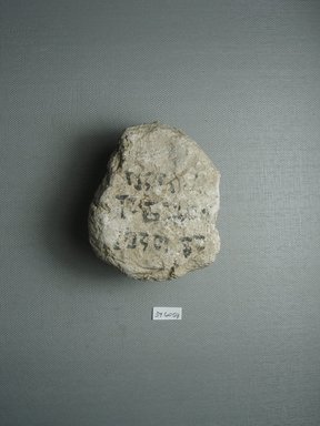  <em>Small Lump of Plaster with Black Ink Inscription</em>, ca. 1352-1336 B.C.E. Plaster, pigment, 2 7/8 x 2 1/16 x 3 1/2 in. (7.3 x 5.2 x 8.9 cm). Brooklyn Museum, Gift of the Egypt Exploration Society, 34.6059. Creative Commons-BY (Photo: Brooklyn Museum, CUR.34.6059_view1.jpg)