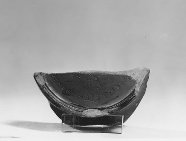 Greek. <em>Potsherd with Forged Inscription</em>, 450-300 B.C.E. and much later. Clay, pigment, 1 9/16 x 2 7/16 in. (3.9 x 6.2 cm). Brooklyn Museum, Charles Edwin Wilbour Fund, 34.690. Creative Commons-BY (Photo: Brooklyn Museum, CUR.34.690_NegC_print_bw.jpg)