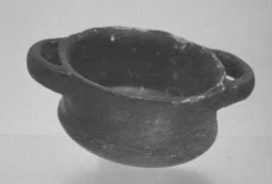 Attic. <em>Miniature Skyphos</em>, 4th century B.C.E. (probably). Clay, glaze, 5/8 x diam. without handles 1 1/4 in. (1.6 x 3.2 cm). Brooklyn Museum, Charles Edwin Wilbour Fund, 34.728. Creative Commons-BY (Photo: Brooklyn Museum, CUR.34.728_print_cropped_bw.jpg)