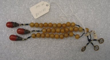  <em>Pendant from Imperial Necklace</em>, 19th-early 20th century. Yellow jasper, coral, glass pearls, brass, 7 1/8 x 1 1/4 in. (18.1 x 3.2 cm). Brooklyn Museum, Brooklyn Museum Collection, 34.944. Creative Commons-BY (Photo: Brooklyn Museum, CUR.34.944.jpg)