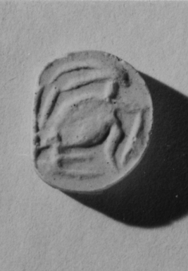  <em>Diskoid Seal or Stamp</em>. Steatite, glaze, Diam. 11/16 in. (1.8 cm). Brooklyn Museum, Gift of Theodora Wilbour from the collection of her father, Charles Edwin Wilbour, 35.1166. Creative Commons-BY (Photo: , CUR.35.1166_NegID_35.1108GRPA_print_cropped_bw.jpg)