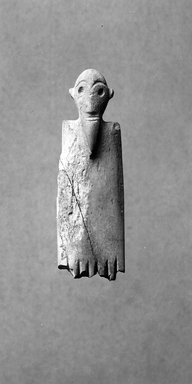  <em>Comb with Human Image</em>, ca. 3500-3400 B.C.E. Bone, 7/8 x 2 5/8 in. (2.2 x 6.6 cm). Brooklyn Museum, Charles Edwin Wilbour Fund, 35.1267. Creative Commons-BY (Photo: Brooklyn Museum, CUR.35.1267_NegB_print_bw.jpg)