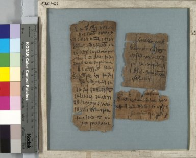  <em>Three Papyrus Fragments Inscribed in Demotic</em>, 332 B.C.E.-395 C.E. Papyrus, ink, Glass: 8 7/16 x 8 7/16 in. (21.5 x 21.5 cm). Brooklyn Museum, Gift of Theodora Wilbour, 35.1462 (Photo: Brooklyn Museum, CUR.35.1462_front_IMLS_PS5.jpg)