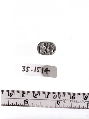  <em>Seal</em>. Steatite, glaze, 3/16 x 7/16 x 9/16 in. (0.5 x 1.1 x 1.5 cm). Brooklyn Museum, Gift of Theodora Wilbour from the collection of her father, Charles Edwin Wilbour, 35.1514. Creative Commons-BY (Photo: Brooklyn Museum, CUR.35.1514_obverse_bw.jpg)
