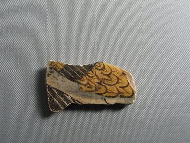  <em>Fragment Depicting Two Wings</em>, ca. 1352–1332 B.C.E. Faience, 1 5/8 × 3/8 × 3 1/16 in. (4.2 × 1 × 7.8 cm). Brooklyn Museum, Gift of the Egypt Exploration Society, 35.2007. Creative Commons-BY (Photo: , CUR.35.2007_view01.jpg)