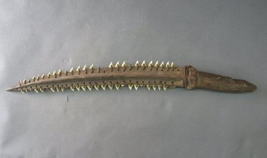 Kiribati. <em>Shark Teeth Sword</em>. Wood, shark teeth, sennit, 19 1/8 x 2 3/16 in (48.5 x 5.5 cm). Brooklyn Museum, Gift of Appleton Sturgis, 35.2227. Creative Commons-BY (Photo: Brooklyn Museum, CUR.35.2227.jpg)