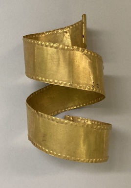 Calima. <em>Head Band</em>, 100 B.C.E.– 800 C.E. Gold, 1 7/16 × 3 × 5 in. (3.7 × 7.6 × 12.7 cm). Brooklyn Museum, Alfred W. Jenkins Fund, 35.365. Creative Commons-BY (Photo: Brooklyn Museum, CUR.35.365.jpg)