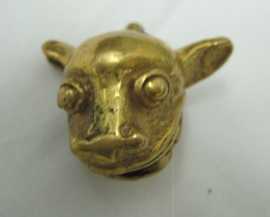  <em>Gold Bell in the Form of an Animal Head with Ball Inside</em>. Gold, 1 1/8 x 3/4 x 1 1/8 in. (2.9 x 1.9 x 2.9 cm). Brooklyn Museum, Alfred W. Jenkins Fund, 35.71. Creative Commons-BY (Photo: Brooklyn Museum, CUR.35.71_front.jpg)