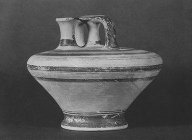 Mycenaean. <em>Stirrup-Jar</em>. Clay, slip, 4 11/16 x Diam. 5 7/8 in. (11.9 x 14.9 cm). Brooklyn Museum, Charles Edwin Wilbour Fund, 35.764. Creative Commons-BY (Photo: Brooklyn Museum, CUR.35.764_print_bw.jpg)