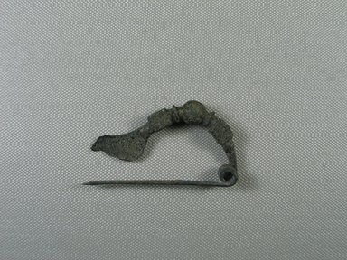  <em>Fibula in the Shape of a Bow</em>, ca.1200 B.C.E. Bronze, Length: 2 15/16 in. (7.4 cm). Brooklyn Museum, Charles Edwin Wilbour Fund, 35.810. Creative Commons-BY (Photo: Brooklyn Museum, CUR.35.810_view01.jpg)