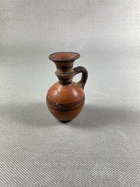 Cypriot. <em>Oinochoe</em>, 700-600 B.C.E. Terracotta, slip, 2 7/16 × 1 7/16 × 1 5/8 in. (6.2 × 3.7 × 4.2 cm). Brooklyn Museum, Brooklyn Museum Collection, 35.825. Creative Commons-BY (Photo: Brooklyn Museum, CUR.35.825_view01.jpg)