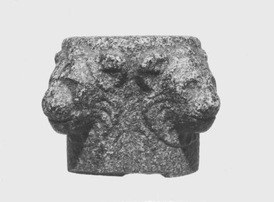  <em>Standard Base with Lion Heads</em>. Granite, 2 13/16 x Diam. 4 5/16 in. (7.1 x 11 cm). Brooklyn Museum, Charles Edwin Wilbour Fund, 35.884. Creative Commons-BY (Photo: Brooklyn Museum, CUR.35.884_NegL710_27A_print_bw.jpg)