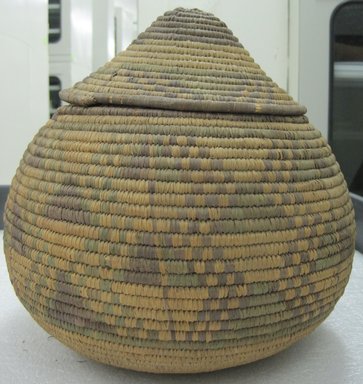  <em>Basket with Cover</em>. Fiber, raffia, reed, 11 3/4 x 9 in. (29.8 x 22.9 cm). Brooklyn Museum, Gift of Edith B. Dexter, 36.108. Creative Commons-BY (Photo: Brooklyn Museum, CUR.36.108a-b_side.jpg)