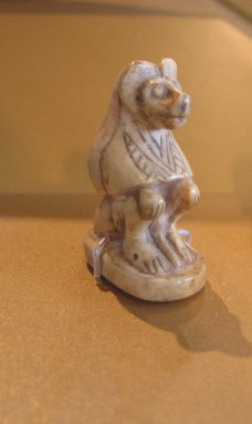  <em>Baboon</em>, ca. 1938-1700 B.C.E. Ivory, 1 3/4 x 2 7/8 in. (4.4 x 7.4 cm). Brooklyn Museum, Charles Edwin Wilbour Fund, 36.121. Creative Commons-BY (Photo: Brooklyn Museum, CUR.36.121_erg2.jpg)