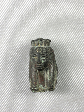  <em>Small Head Possibly of Isis or an Unknown Queen</em>. Bronze, 1 7/8 × 1 1/16 × 1 1/16 in. (4.7 × 2.7 × 2.7 cm). Brooklyn Museum, Charles Edwin Wilbour Fund, 36.130. Creative Commons-BY (Photo: , CUR.36.130_view01.jpg)