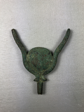  <em>Horns, Forming the Headdress of a Statue of Hathor</em>, 664-525 B.C.E. Bronze, 3 3/8 × 2 7/8 × 7/16 in. (8.5 × 7.3 × 1.1 cm). Brooklyn Museum, Charles Edwin Wilbour Fund, 36.136. Creative Commons-BY (Photo: , CUR.36.136_view01.jpg)