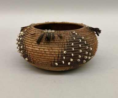 Pomo. <em>Small Basket decorated with white beads and red and black feathers.</em>. Fiber, feather, bead, 2 3/4 x 3 9/16in. (7 x 9cm). Brooklyn Museum, Gift of Frederic B. Pratt, 36.521. Creative Commons-BY (Photo: Brooklyn Museum, CUR.36.521.jpg)