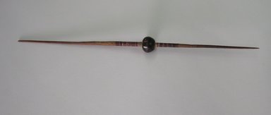  <em>Spindle with Whorl</em>. Wood, clay, pigment, 5/8 x 10 1/8 in. (1.6 x 25.7 cm). Brooklyn Museum, Gift of Dr. John H. Finney, 36.755.19. Creative Commons-BY (Photo: Brooklyn Museum, CUR.36.755.19.jpg)