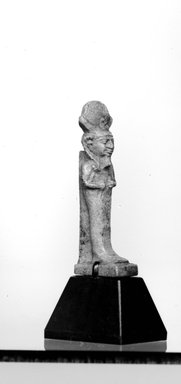  <em>Amulet of Khonsu?</em>, 664-332 B.C.E. Faience, 1 1/4 x 5/16 in. (3.2 x 0.8 cm). Brooklyn Museum, Charles Edwin Wilbour Fund, 37.1029E. Creative Commons-BY (Photo: Brooklyn Museum, CUR.37.1029E_NegID_37.1009E_GRPA_cropped_bw.jpg)